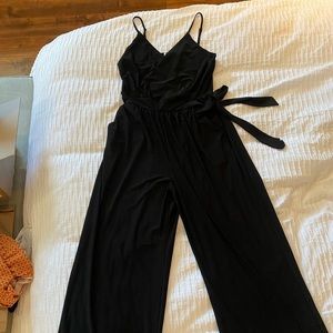 Versatile, comfortable jumpsuit with adjustable spaghetti straps.